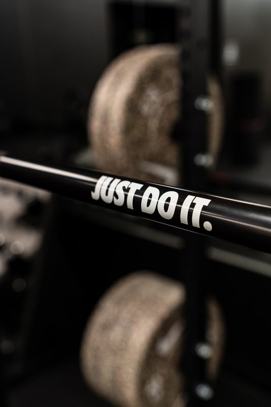 Barbell and bumper plates in the Impact Performance strength area