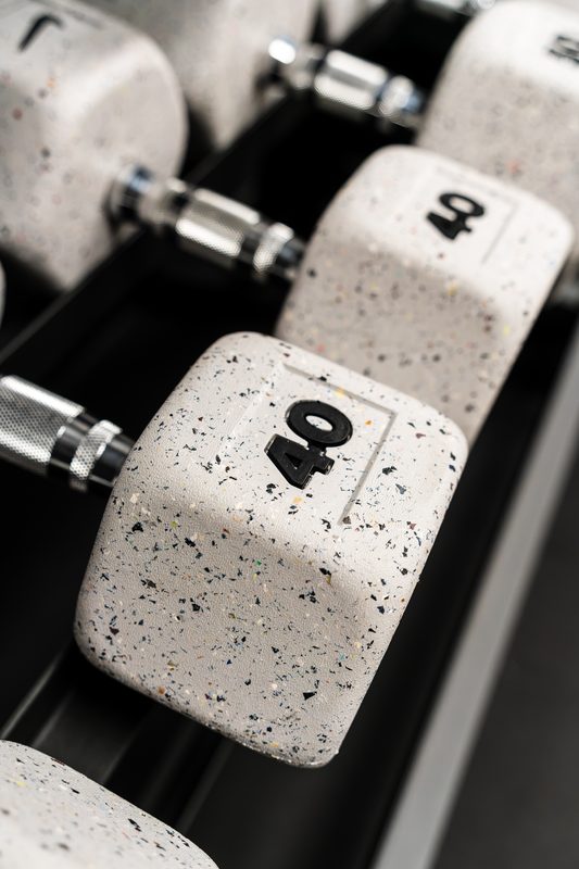 Close-up of dumbbells on the rack at Impact Performance