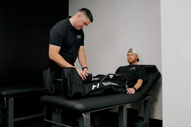 Compression therapy session at Impact Performance