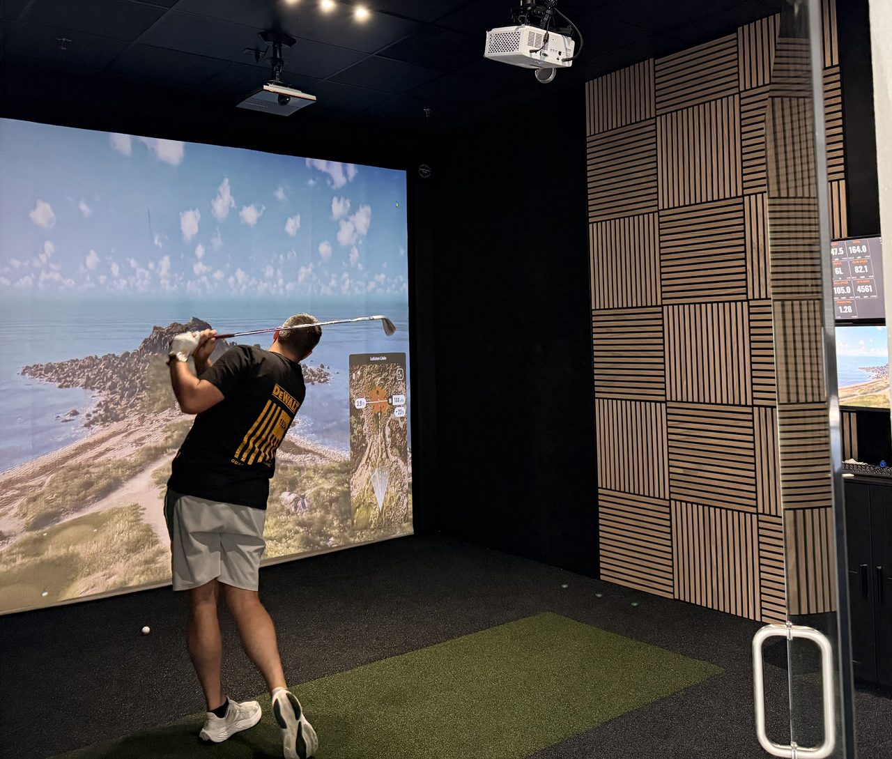 TrackMan golf simulator studio at Impact Performance in Suntree Viera, showing live ball flight data